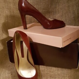 A pair of shoes sitting on top of a box.