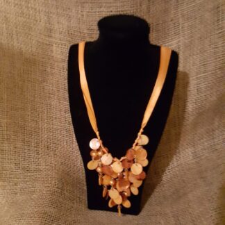 A necklace is shown on display in front of a black background.