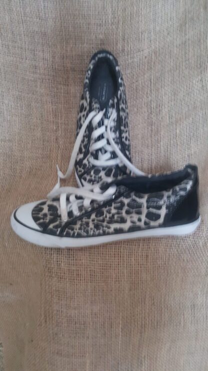A pair of shoes that are on the ground.