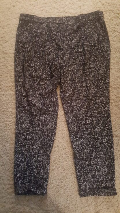 A pair of pants that are on the floor.