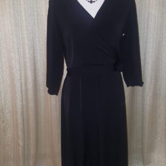 A black dress is shown with a white shirt.