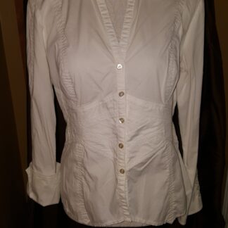 A white shirt is shown with buttons on the front.