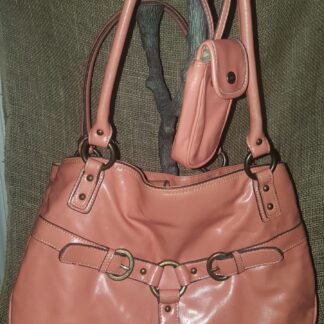 A purse and wallet are hanging on the wall.