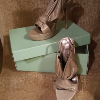 A pair of shoes sitting on top of a box.