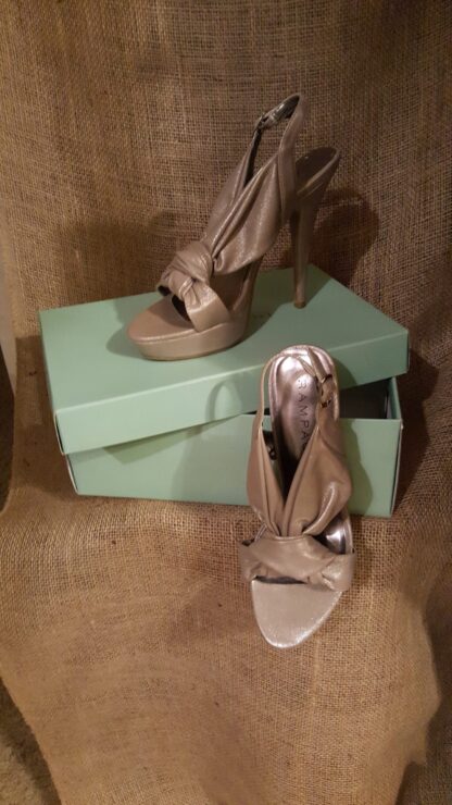 A pair of shoes sitting on top of a box.