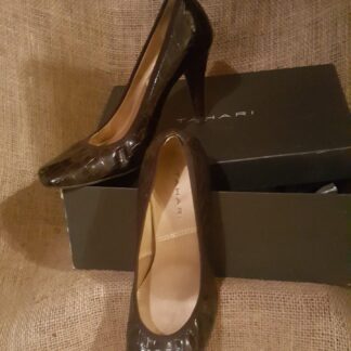 A pair of shoes sitting on top of a box.
