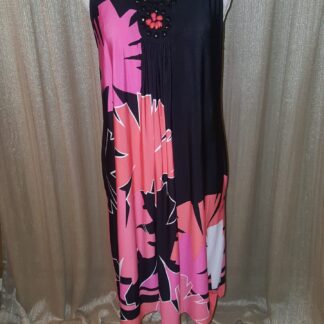 A black and pink dress with flowers on it