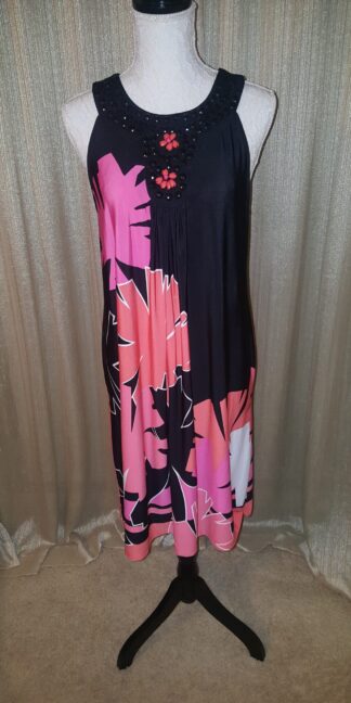 A black and pink dress with flowers on it