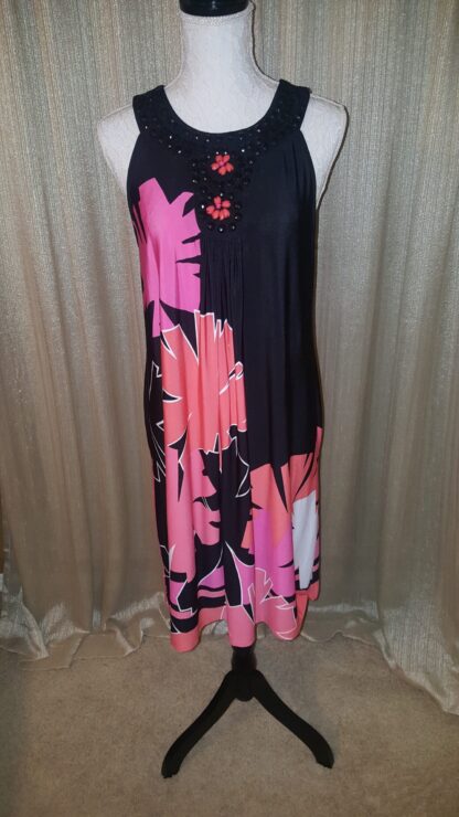 A black and pink dress with flowers on it