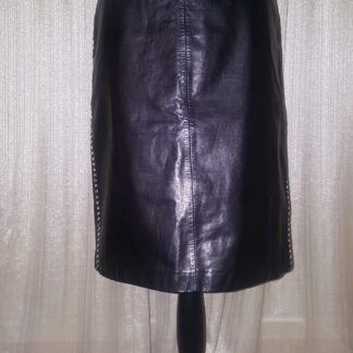 A black leather skirt is shown on display.