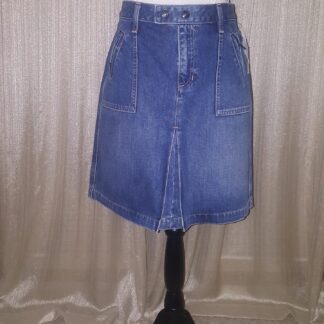 A blue skirt is on display in front of a white background.