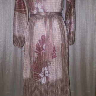 A dress that is very long and has flowers on it.