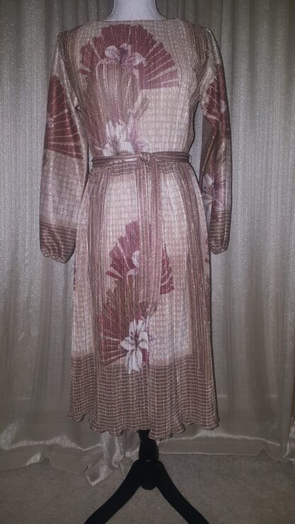 A dress that is very long and has flowers on it.