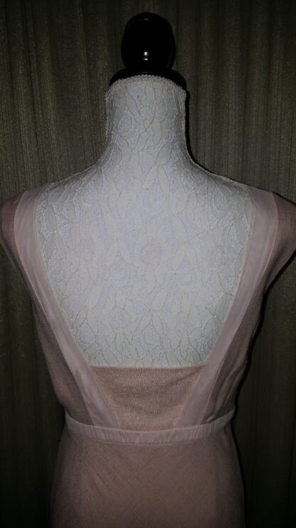 A mannequin with a dress on and no clothes