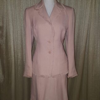 A pink suit is shown with a skirt.