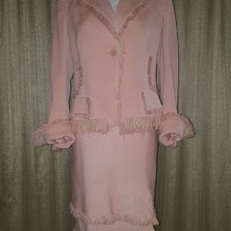A pink suit with a ruffled skirt and jacket.