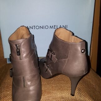 A pair of shoes that are on top of a box.
