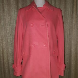 A pink coat is shown on display.