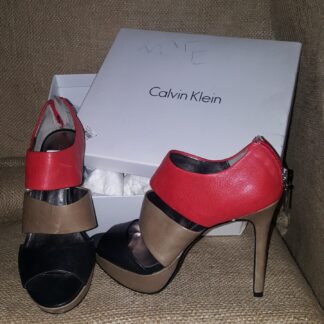 A pair of shoes sitting on top of a box.