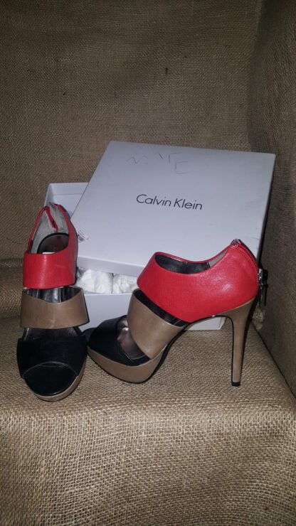 A pair of shoes sitting on top of a box.