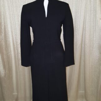A black dress is shown with long sleeves.