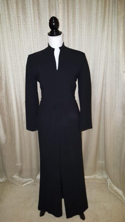 A black dress is shown with long sleeves.