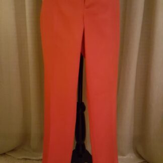 A pair of red pants hanging up on the wall.