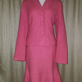 A pink suit is shown with a skirt.