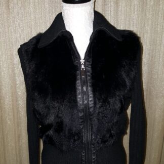 A black vest with fur collar and leather trim.