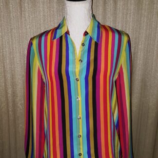 A woman wearing a colorful striped shirt.