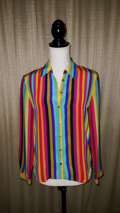 A woman wearing a colorful striped shirt.