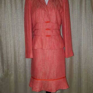 A pink suit with a red trim is shown.