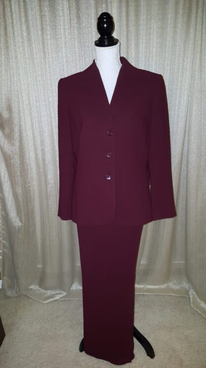 A suit that is red and has buttons on it.