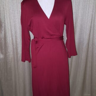A red dress is shown on the mannequin.