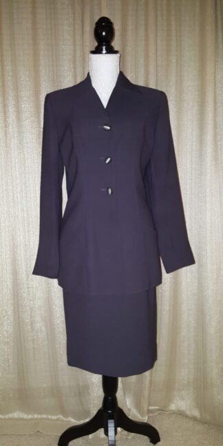 A suit is shown with a skirt and jacket.