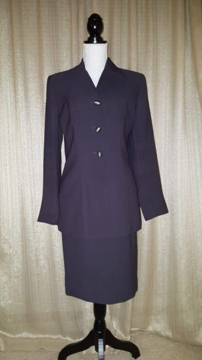 A suit is shown with a skirt and jacket.