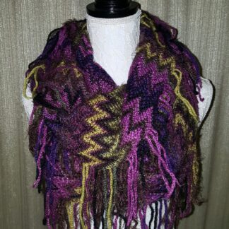 A purple, yellow and black scarf is draped around the neck.