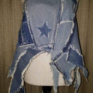 A mannequin wearing jeans with star patches.