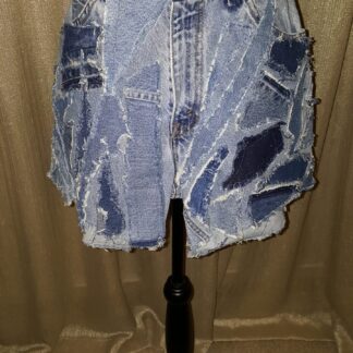 A denim shorts with different patches on it