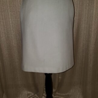 A white skirt is on a black stand