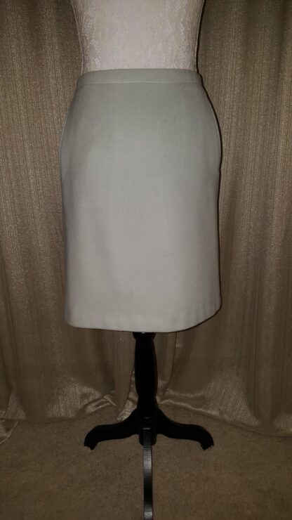A white skirt is on a black stand