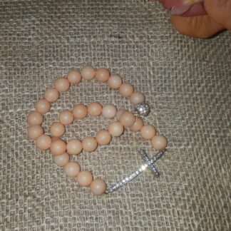 A small bead is laying on the floor