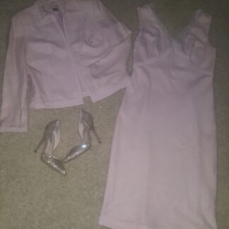 A white dress and jacket on the floor