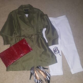 A green jacket, white pants and red purse.