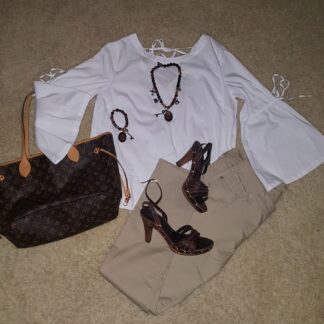 A white top, brown pants and black shoes.
