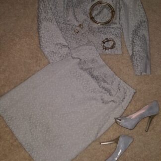 A pair of shoes and a skirt on the floor