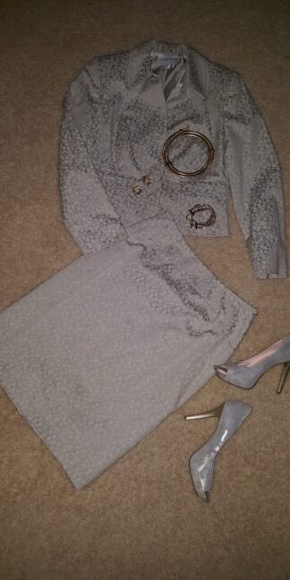 A pair of shoes and a skirt on the floor