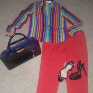 A woman 's outfit with red pants and striped shirt.