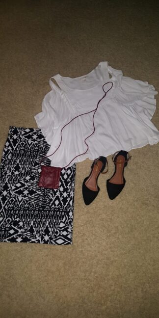 A pair of shoes and a bag on the floor