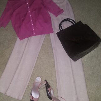 A pink shirt and white pants with shoes